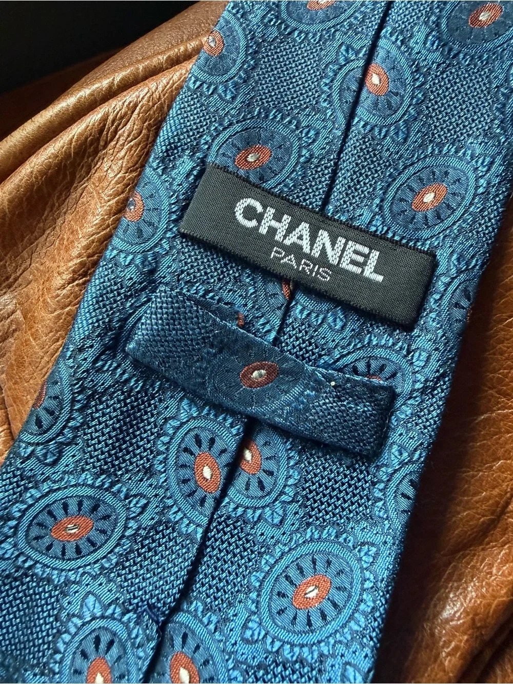 CHANEL Midnight Blue Silk Tie with Circular Terracota Medallion Motif